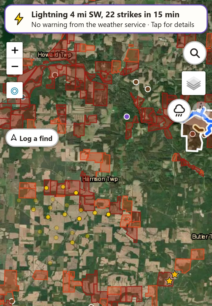 The app's lightning banner: Lightning 4 miles southwest, 22 strikes in 15 minutes, no warning from the weather service, with the strikes as small yellow marks on the map.